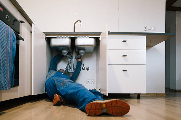 Professional Drain Cleaning technician working in Littleton, MA
